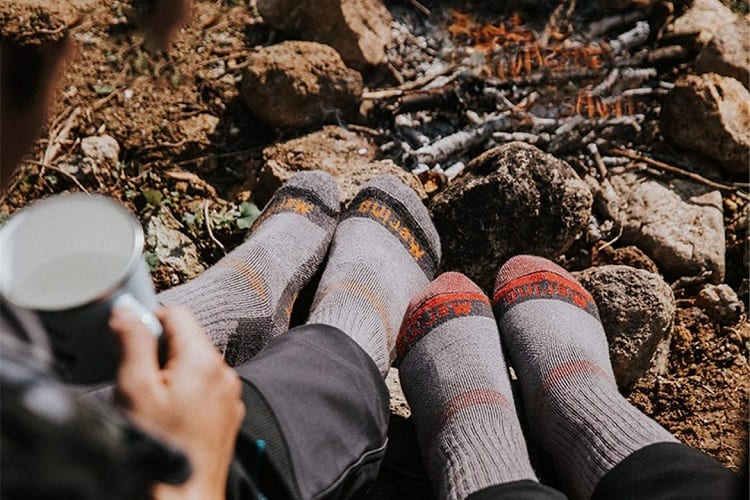 warming feet by the campfire